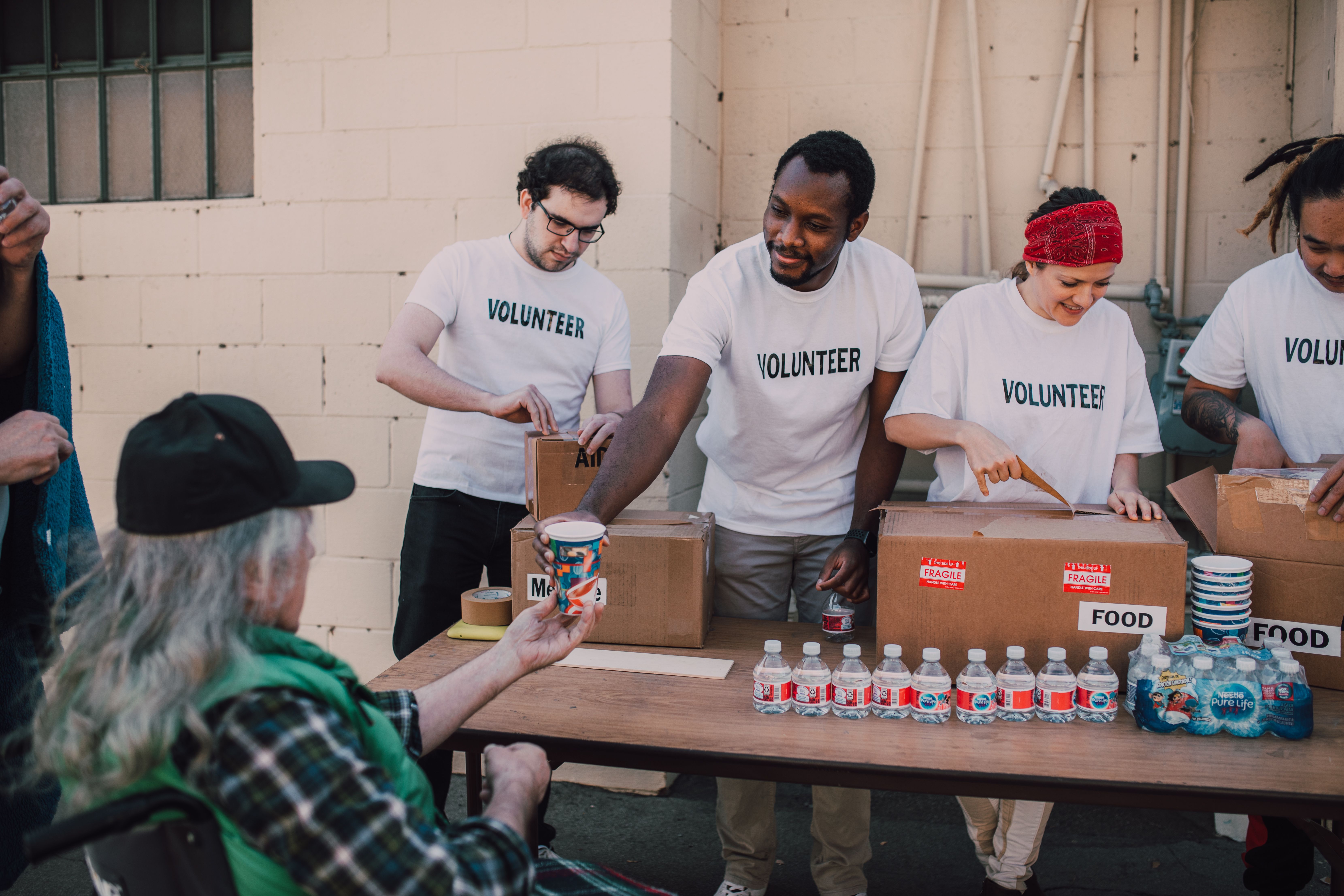 Volunteers working together; illustrative stock photo